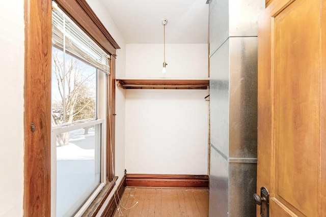 walk in closet featuring hardwood / wood-style flooring