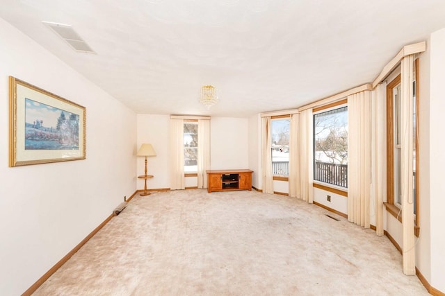 miscellaneous room with light colored carpet