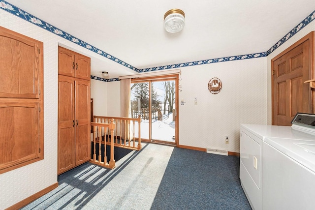 washroom with dark carpet and washing machine and clothes dryer