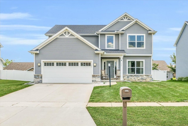 craftsman-style house with a front yard and a garage