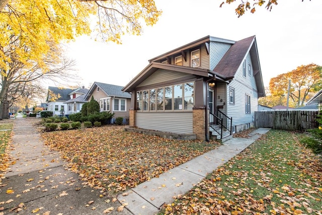 view of front facade featuring a sunroom