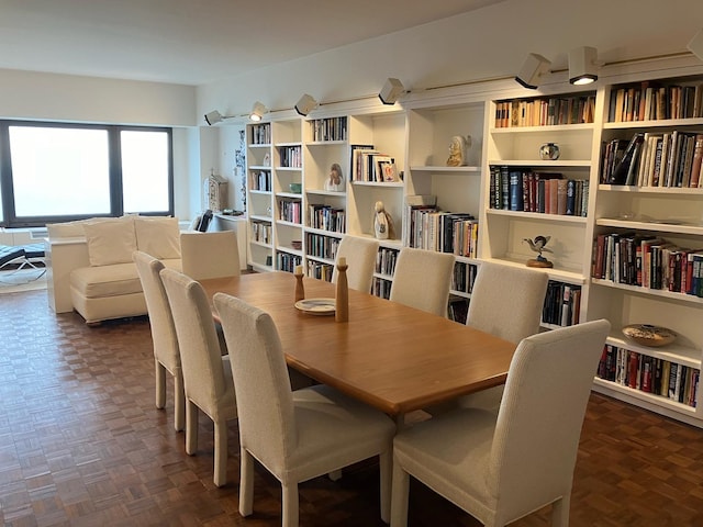 dining room with dark parquet floors