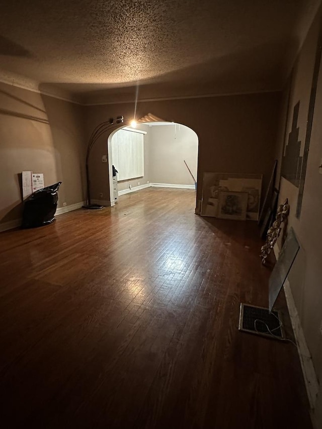 interior space featuring hardwood / wood-style floors and a textured ceiling