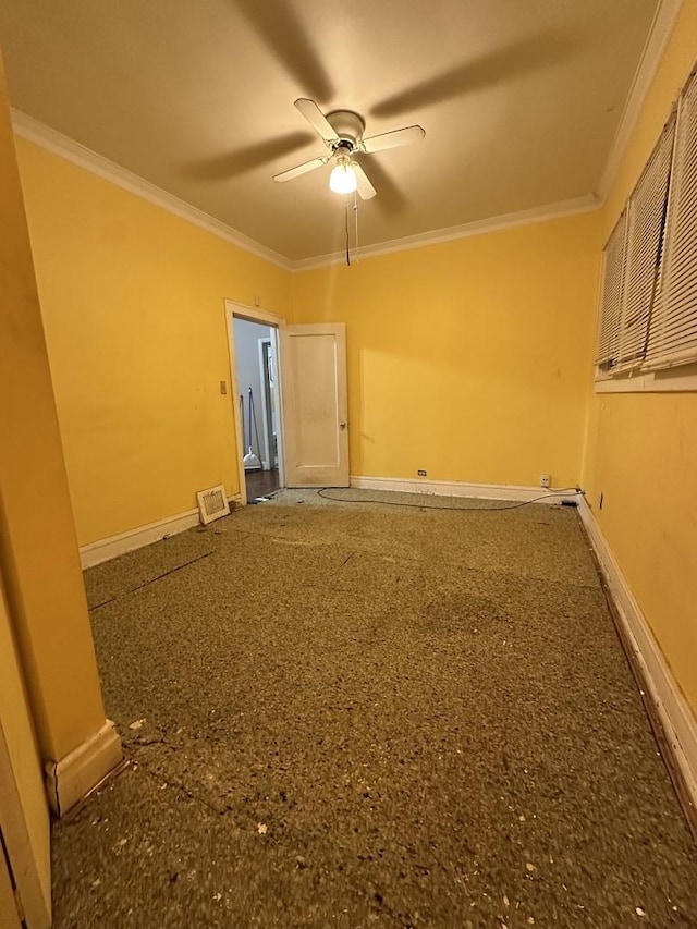 spare room with ceiling fan and crown molding