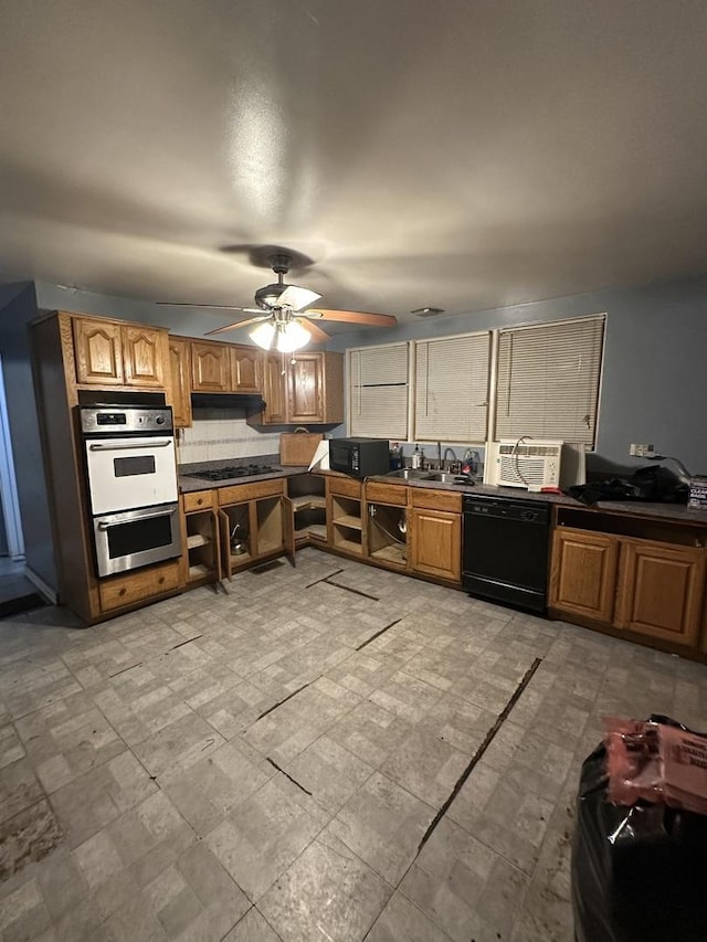 kitchen featuring sink, tasteful backsplash, ceiling fan, and black appliances