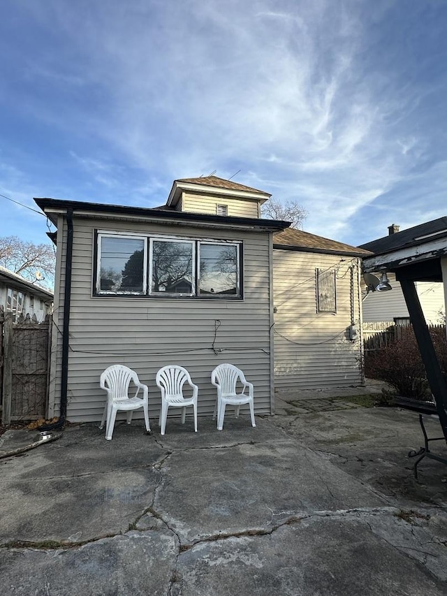 back of property featuring a patio area