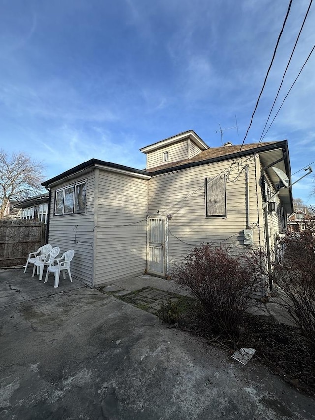 back of house with a patio