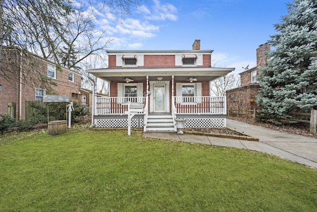 view of front of home featuring a porch and a front yard