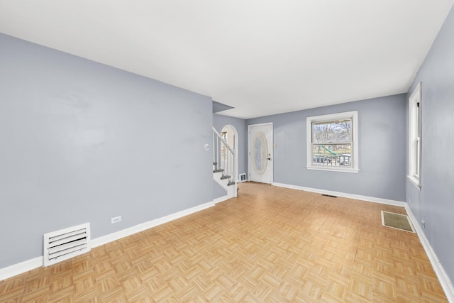 spare room featuring light parquet floors