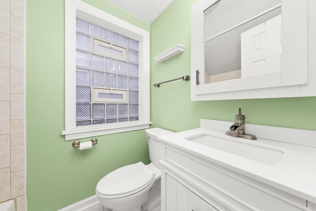 bathroom with vanity and toilet