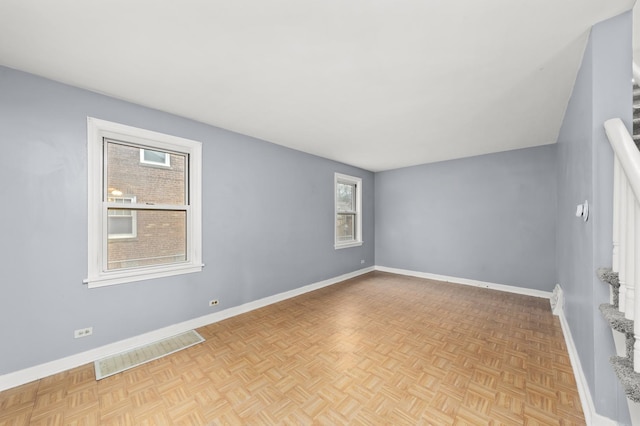 empty room with light parquet floors