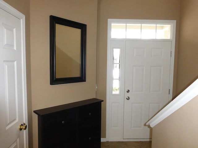 entrance foyer featuring tile patterned floors