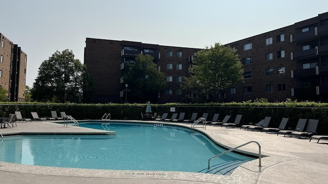 view of swimming pool with a patio area