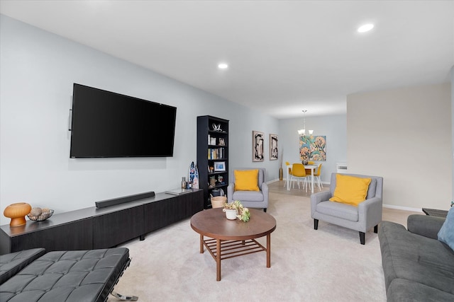 living room with a notable chandelier and light carpet