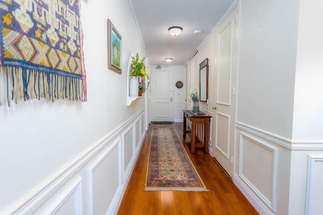 hallway with dark hardwood / wood-style floors