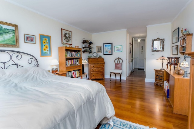 bedroom with dark wood-type flooring and crown molding