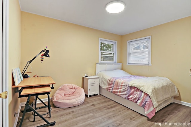 bedroom with light hardwood / wood-style flooring