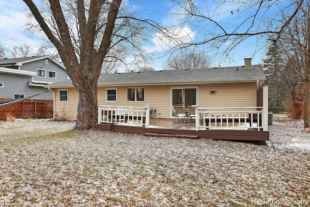 back of property with a deck