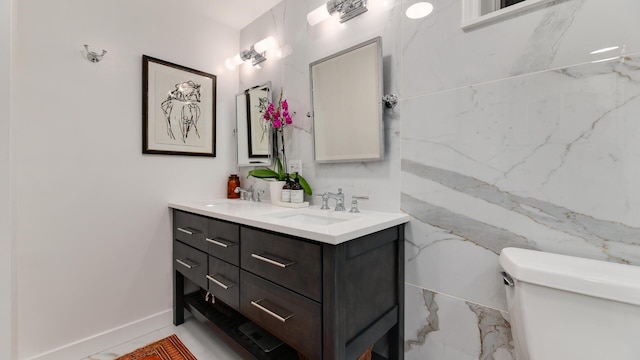 bathroom with toilet and vanity