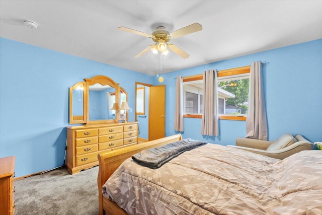 bedroom with ceiling fan and carpet