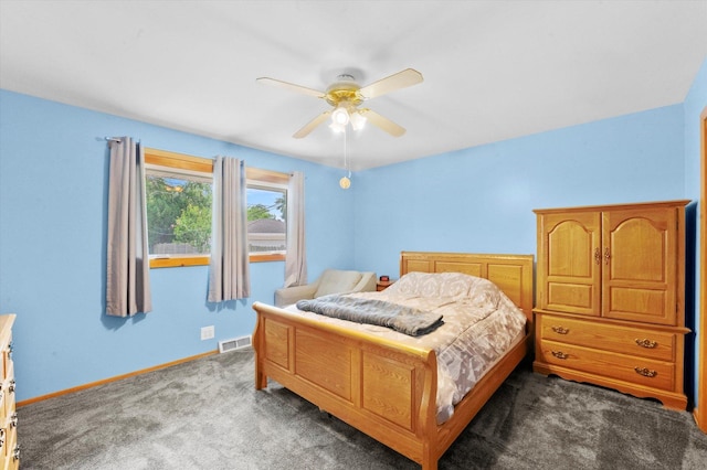 bedroom featuring ceiling fan and dark colored carpet