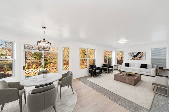 interior space with light hardwood / wood-style flooring and a chandelier