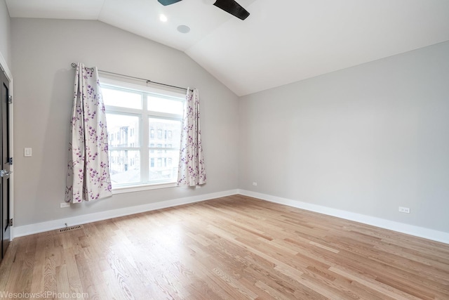 unfurnished room featuring ceiling fan, light hardwood / wood-style flooring, a healthy amount of sunlight, and lofted ceiling