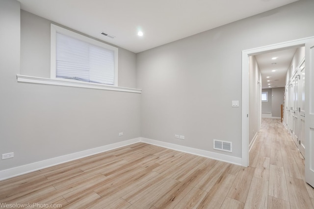 spare room with light hardwood / wood-style floors