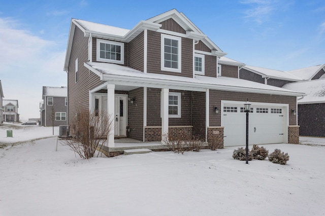 view of front of home with cooling unit and a garage