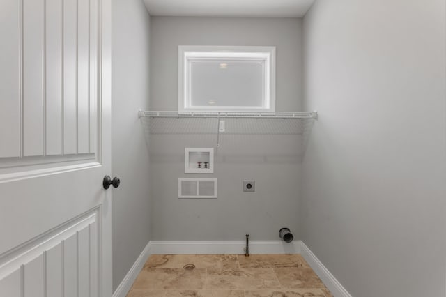 laundry room featuring electric dryer hookup and washer hookup