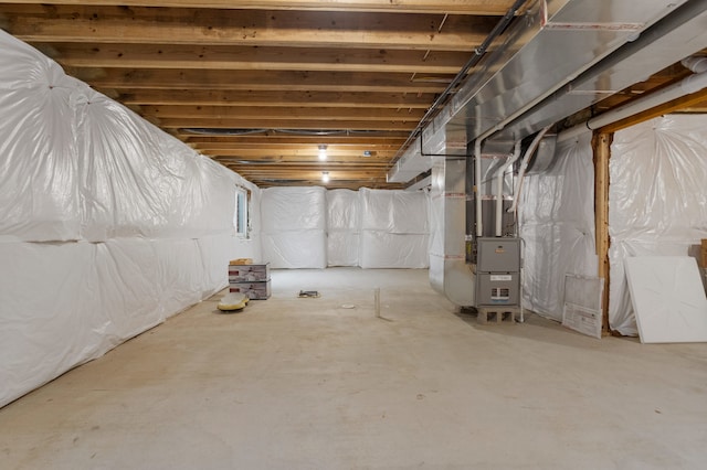 basement featuring heating unit