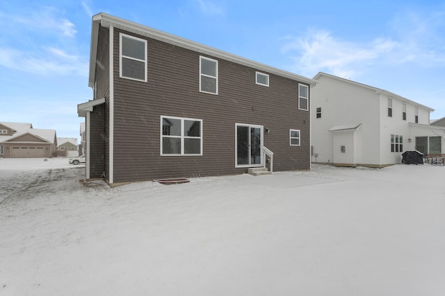 view of snow covered house