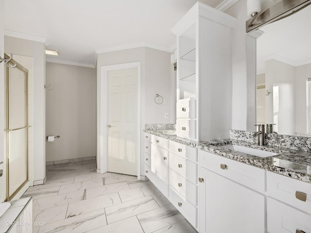 bathroom featuring a shower with door, vanity, and ornamental molding