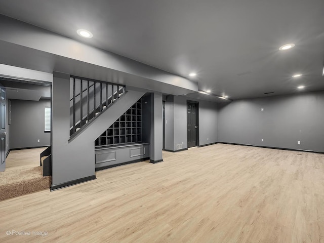 basement featuring light wood-type flooring