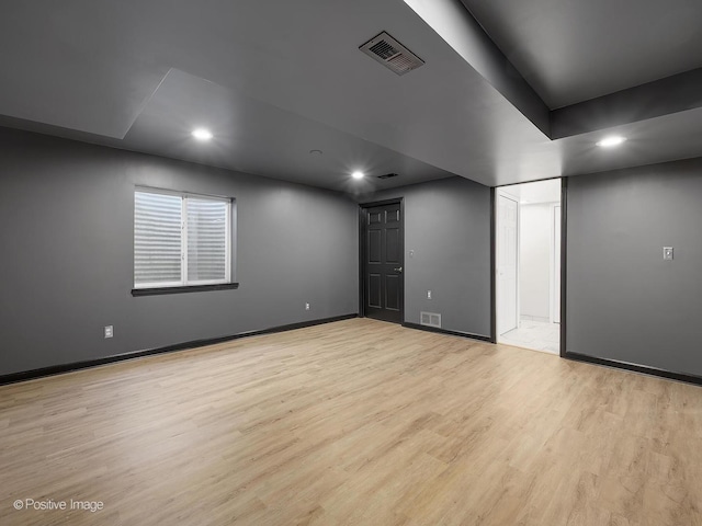 spare room with light hardwood / wood-style floors