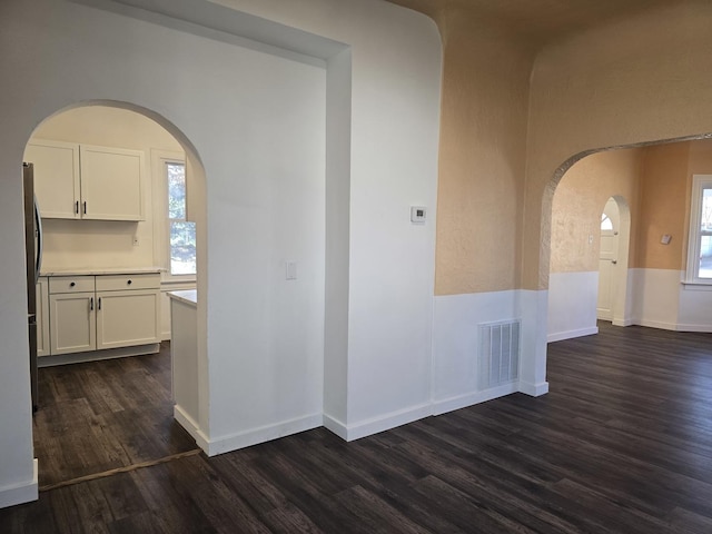 hallway featuring dark wood-type flooring