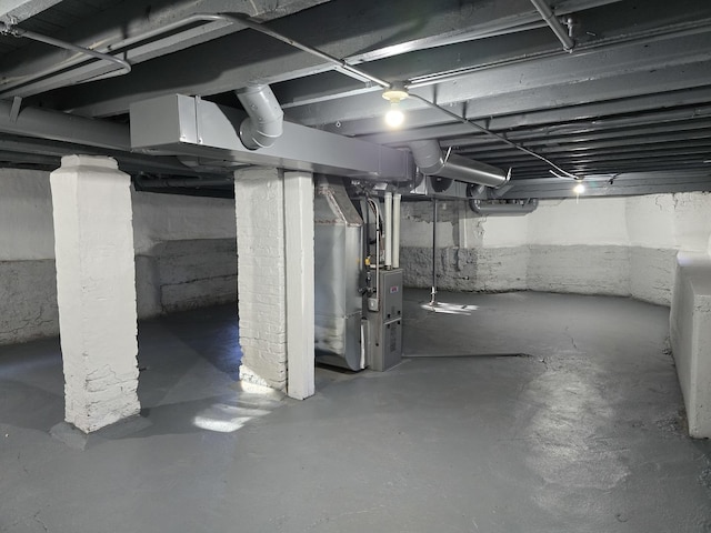 basement featuring heating unit