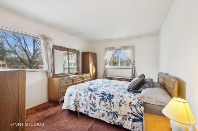 bedroom featuring dark colored carpet