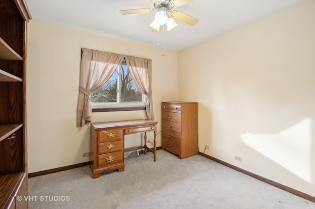 office area featuring ceiling fan and light colored carpet