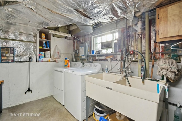 washroom featuring washer and clothes dryer and sink