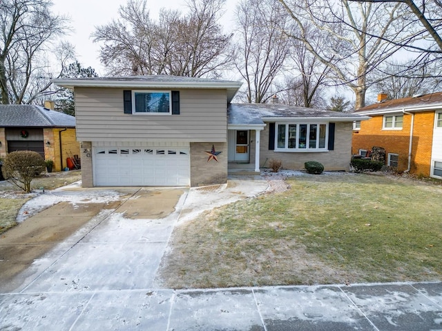 view of front of house with a garage and a front lawn