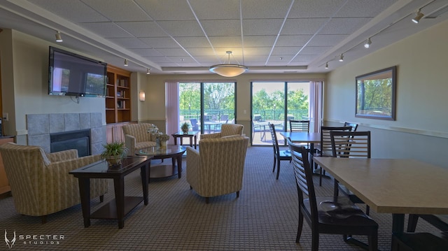 carpeted living room featuring a fireplace