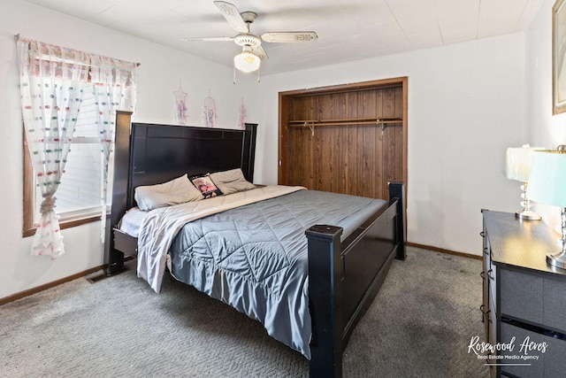 carpeted bedroom featuring ceiling fan and a closet