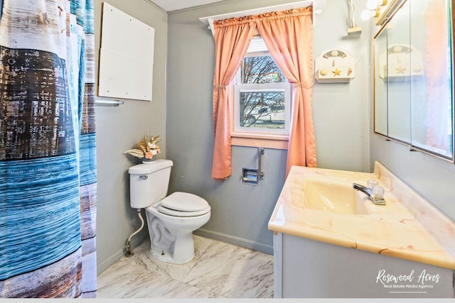 bathroom featuring vanity and toilet