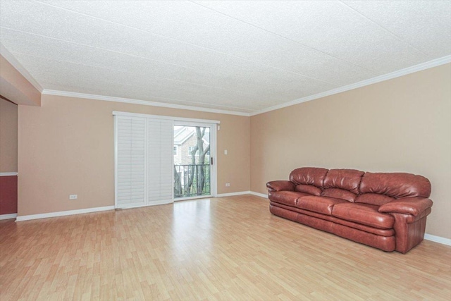 living room with light hardwood / wood-style floors and crown molding