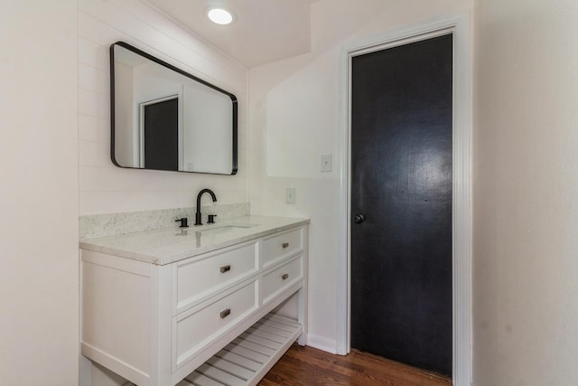 bathroom featuring wood-type flooring and vanity