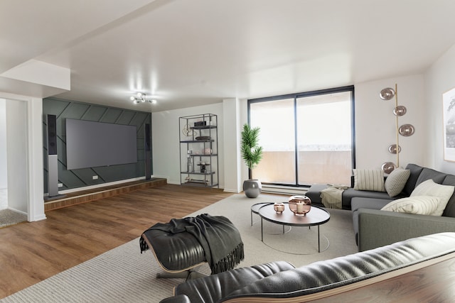 living room featuring hardwood / wood-style flooring and a baseboard heating unit