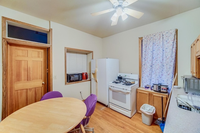 kitchen with ceiling fan, light hardwood / wood-style floors, and white appliances