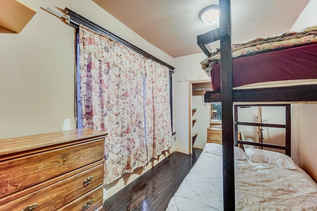 unfurnished bedroom featuring dark hardwood / wood-style floors