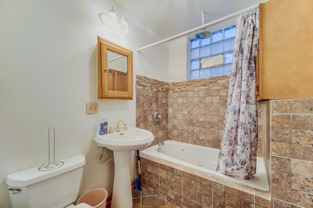 bathroom with toilet and shower / bath combo with shower curtain